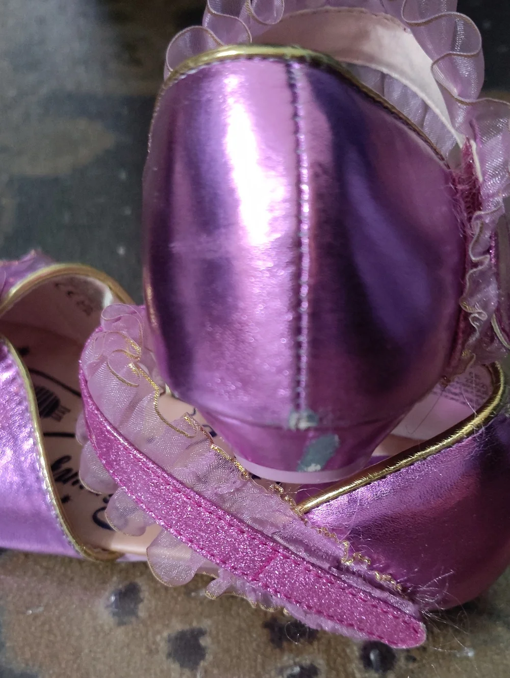 2/3 Rapunzel Slippers $25
